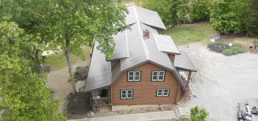 Silver metal roof on log cabin